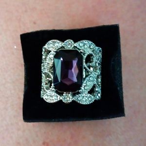 Paparazzi stretch silver toned. Purple center with crystal enhancements.